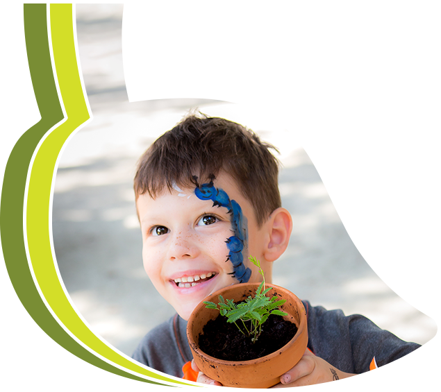 A boy holding a flower pot